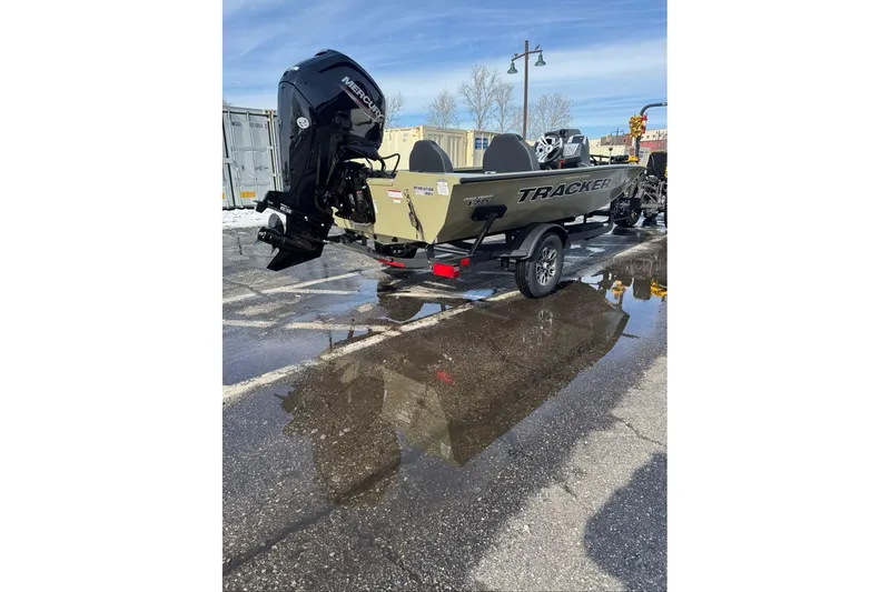 Slide: The Image of 2026 Tracker Pro Team 175 boat with Mercury engine on wet pavement. - 58