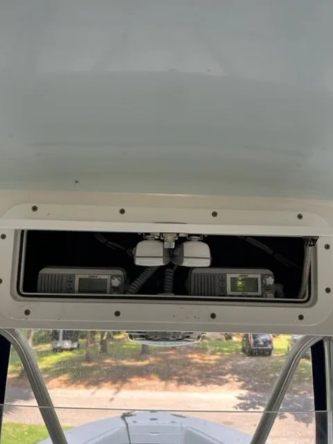 Slide: The Image of 2000 Regulator 23' Center Console boat electronics compartment with communication devices. - 6