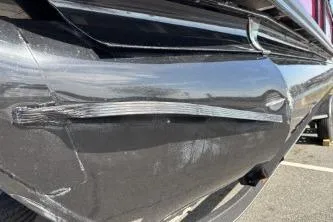 Slide: The Image of 2025 Regency 250 DL3 boat with visible hull damage and scratches. - 10