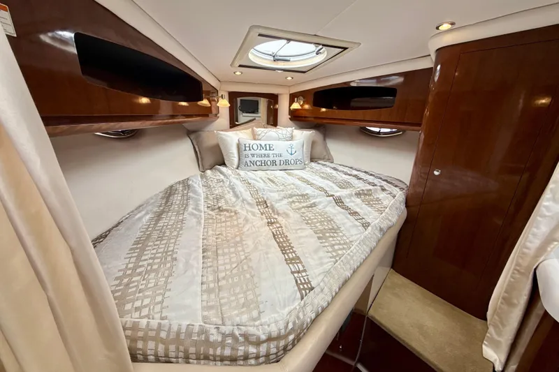 Slide: The Image of Luxurious cabin interior of 2016 Four Winns V335 yacht with cozy bedding. - 20