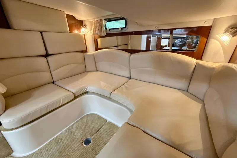 Slide: The Image of Luxurious interior of 2016 Four Winns V335 yacht with plush seating and elegant lighting. - 24