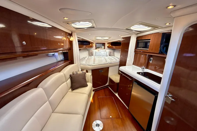 Slide: The Image of Luxurious interior of 2016 Four Winns V335 yacht with cozy seating and modern amenities. - 25