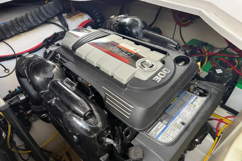 Slide: The Image of Engine compartment of 2016 Four Winns V335 boat, featuring a 300 horsepower engine. - 34