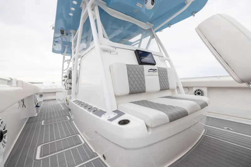 Slide: The Image of 2020 Invincible 40 Catamaran interior with cushioned seating and modern design. - 11
