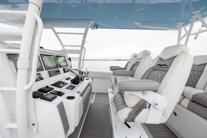 Slide: The Image of 2020 Invincible 40 Catamaran helm with advanced navigation and luxurious seating. - 13