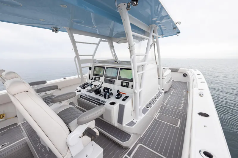 Slide: The Image of 2020 Invincible 40 Catamaran helm with advanced navigation systems and luxurious seating. - 15