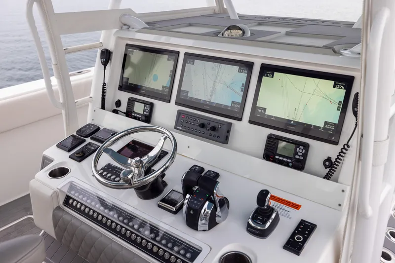 Slide: The Image of Cockpit of 2020 Invincible 40 Catamaran with advanced navigation and control systems. - 16