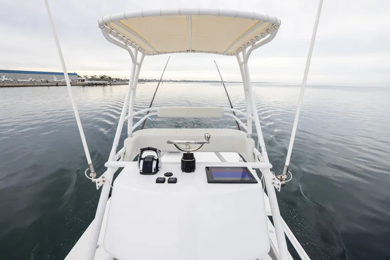 Slide: The Image of 2020 Invincible 40 Catamaran helm with navigation equipment on calm water. - 20