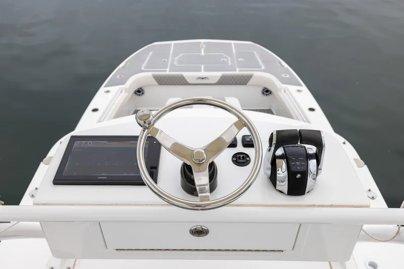 Slide: The Image of Steering console of 2020 Invincible 40 Catamaran with navigation display and controls. - 21