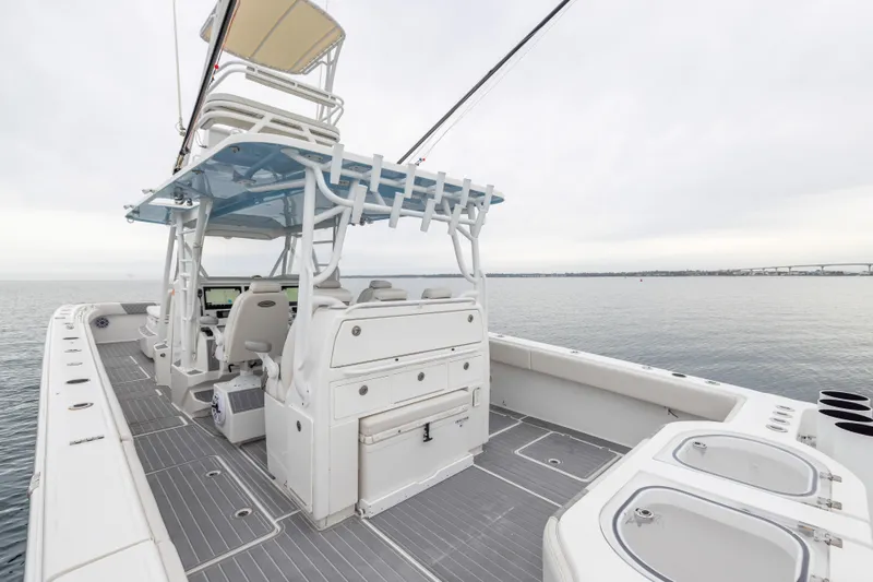 Slide: The Image of 2020 Invincible 40 Catamaran with spacious deck and modern helm on calm waters. - 26