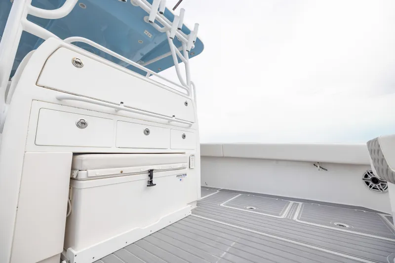 Slide: The Image of 2020 Invincible 40 Catamaran deck with storage compartments and seating area. - 29