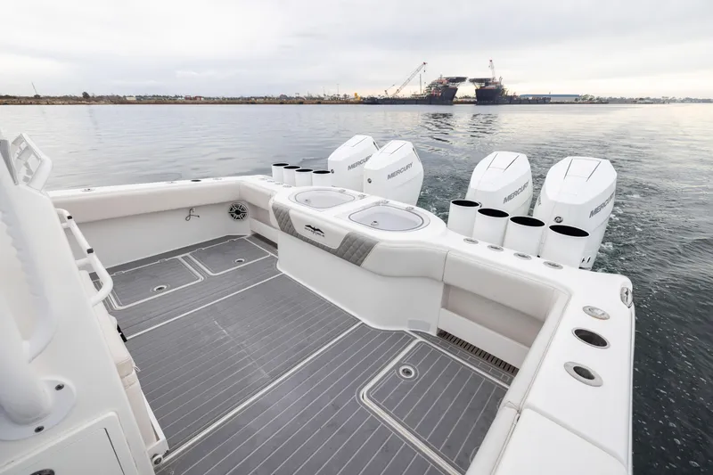 Slide: The Image of 2020 Invincible 40 Catamaran with Mercury engines, spacious deck, and ocean view. - 32