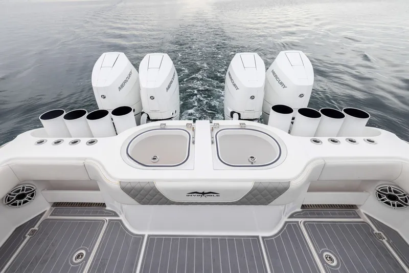 Slide: The Image of 2020 Invincible 40 Catamaran with Mercury engines, featuring dual sinks and rod holders. - 33