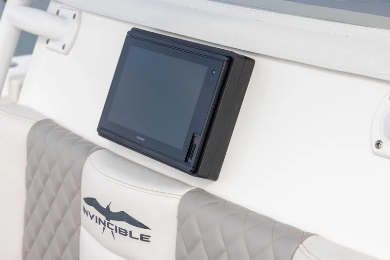 Slide: The Image of Dashboard of 2020 Invincible 40 Catamaran with Garmin display and quilted seating. - 44