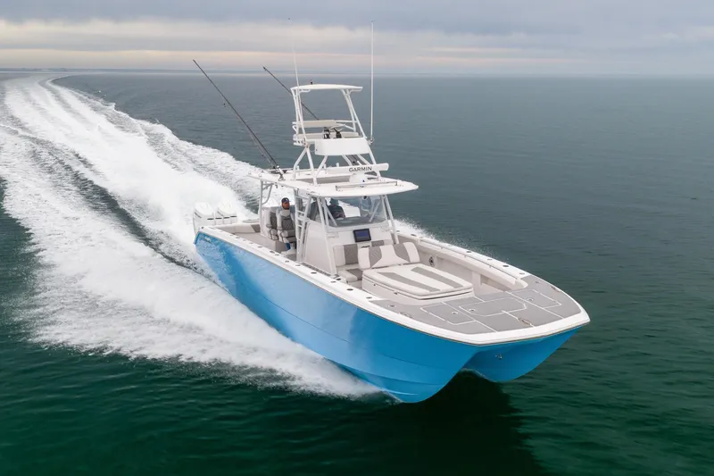 Slide: The Image of 2020 Invincible 40 Catamaran cruising swiftly on open water. - 5