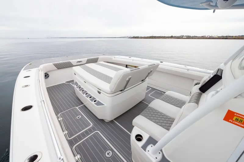 Slide: The Image of Luxurious 2020 Invincible 40 Catamaran interior with sleek seating and ocean view. - 7