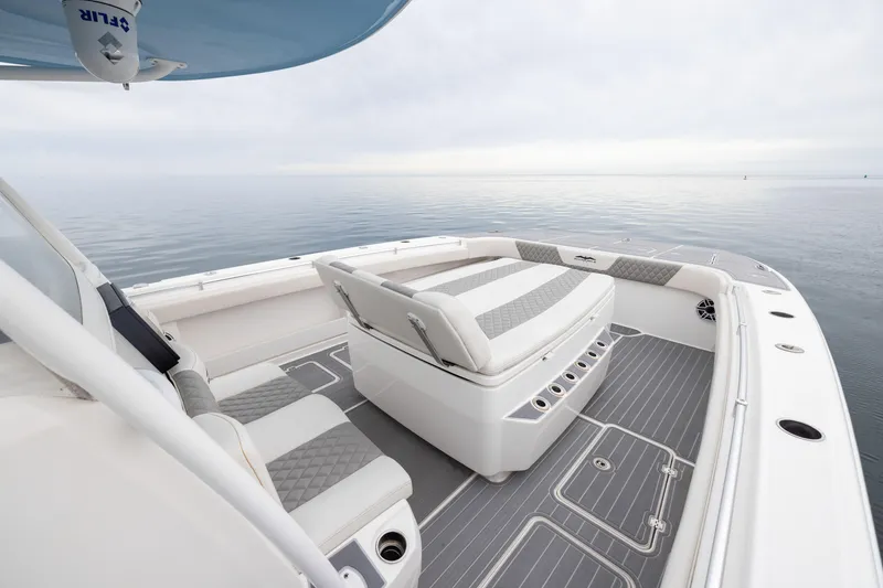 Slide: The Image of 2020 Invincible 40 Catamaran interior with luxurious seating on calm waters. - 8