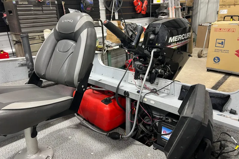 Slide: The Image of 2019 Lund 1600 Fury Tiller boat interior with Mercury EFI FourStroke engine. - 2
