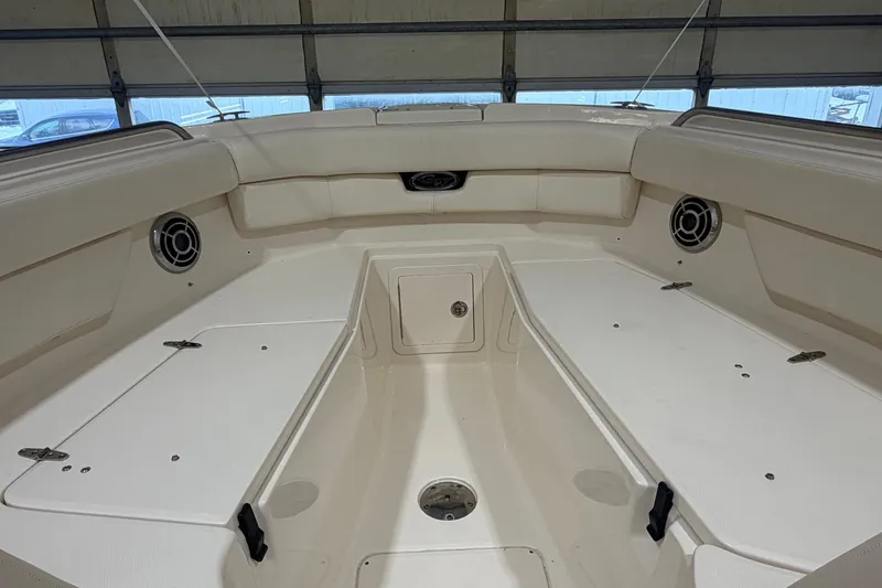 Slide: The Image of 2015 Grady-White Freedom 307 boat interior with seating and storage compartments. - 3