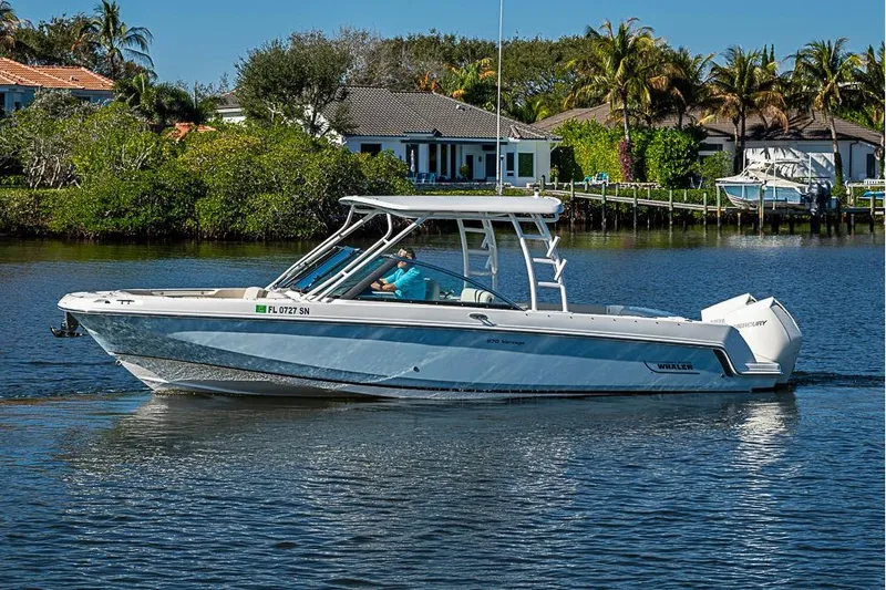 The Image of 2019 Boston Whaler 270 Vantage boat cruising on a scenic waterway. - 0