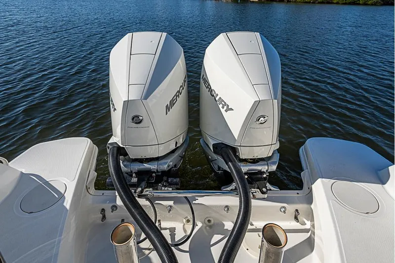 Slide: The Image of 2019 Boston Whaler 270 Vantage with dual Mercury outboard engines on water. - 21
