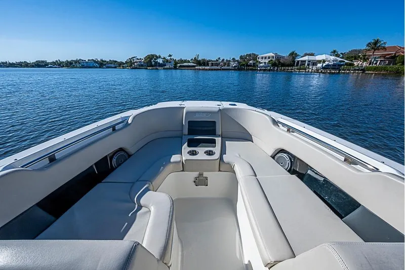 Slide: The Image of 2019 Boston Whaler 270 Vantage boat interior with comfortable seating on a sunny day. - 5
