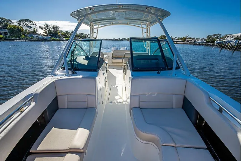 Slide: The Image of 2019 Boston Whaler 270 Vantage boat interior with seating, on a sunny day. - 8