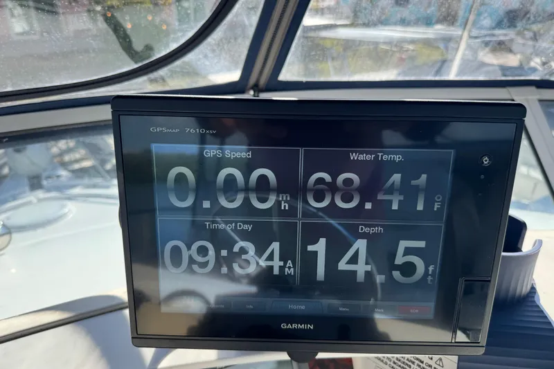 Slide: The Image of Garmin GPS display on 2005 Silverton 43 Motor Yacht showing speed, water temperature, and depth. - 12