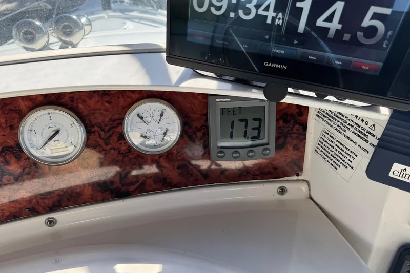 Slide: The Image of Dashboard of 2005 Silverton 43 Motor Yacht with gauges and Garmin display. - 13