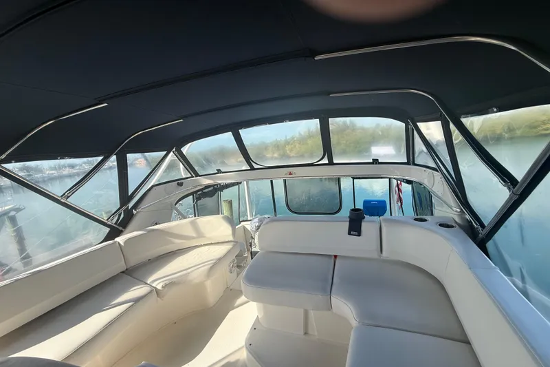 Slide: The Image of 2005 Silverton 43 Motor Yacht interior with spacious seating and panoramic windows. - 21