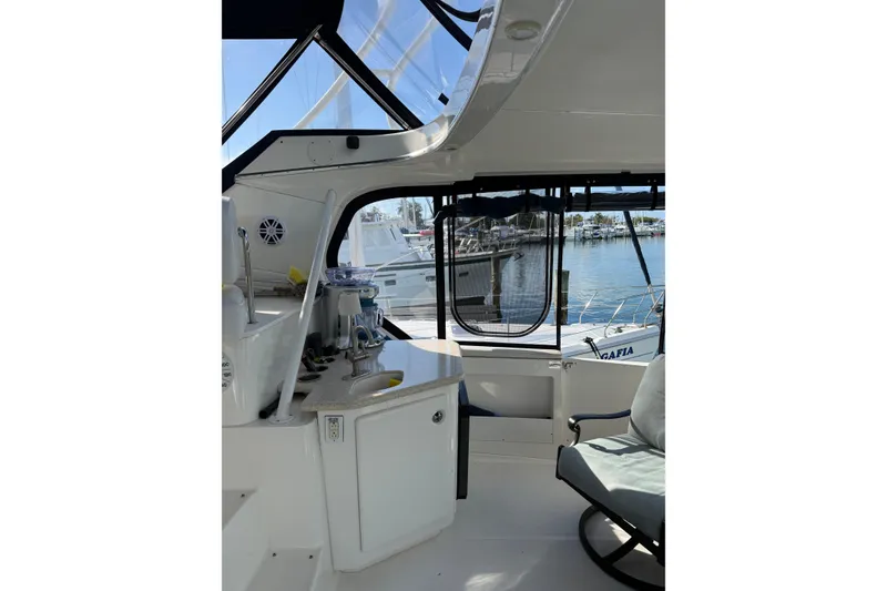 Slide: The Image of Interior view of 2005 Silverton 43 Motor Yacht with marina backdrop. - 23