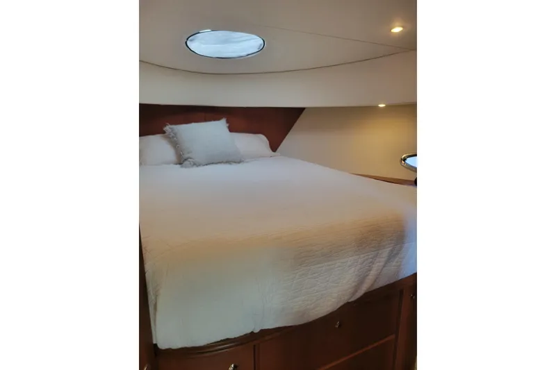 Slide: The Image of Luxurious bedroom interior of 2005 Silverton 43 Motor Yacht with cozy bedding. - 34