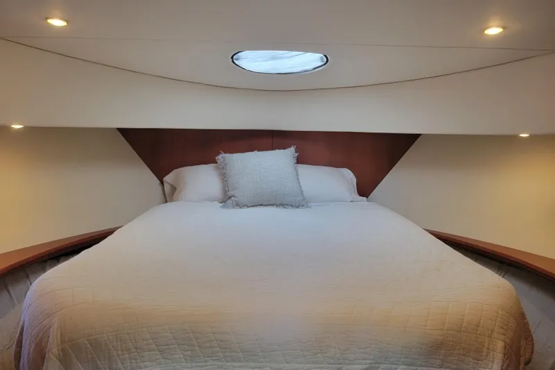 Slide: The Image of Luxurious bedroom interior of 2005 Silverton 43 Motor Yacht with cozy bedding. - 35