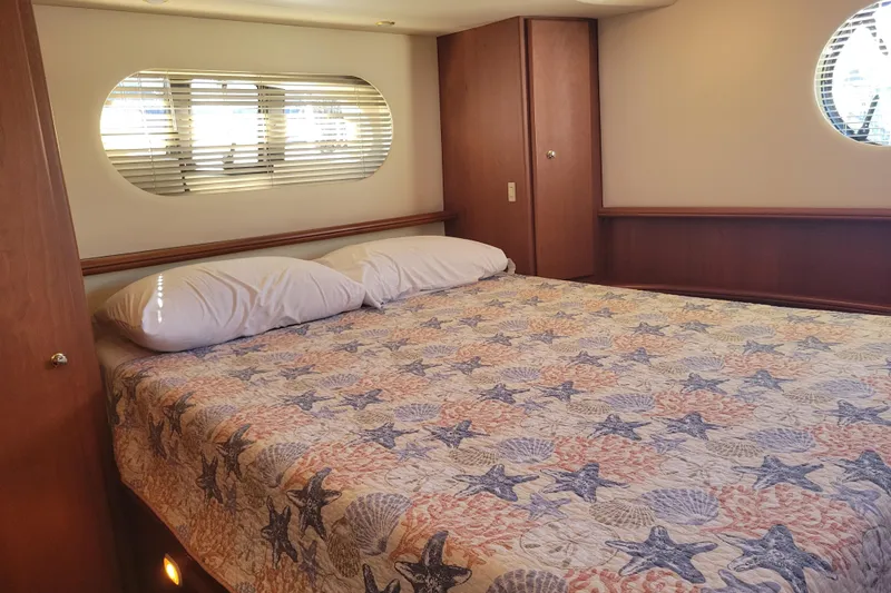 Slide: The Image of Luxurious bedroom in 2005 Silverton 43 Motor Yacht with starfish-themed bedding. - 36