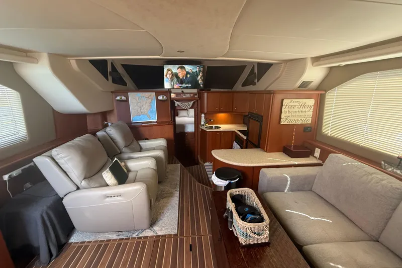 Slide: The Image of Luxurious interior of 2005 Silverton 43 Motor Yacht with comfortable seating and modern amenities. - 4