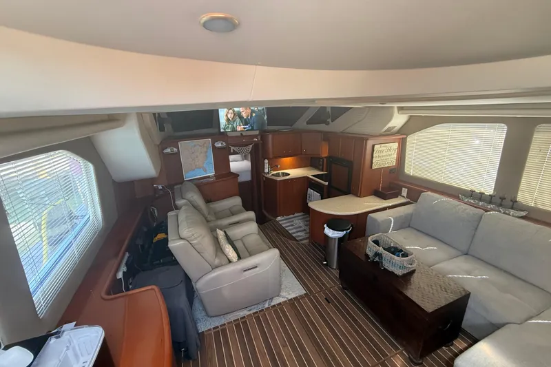 Slide: The Image of Luxurious interior of 2005 Silverton 43 Motor Yacht with modern amenities and cozy seating. - 6