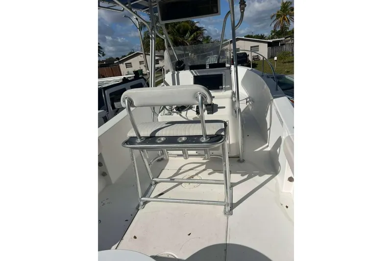 Slide: The Image of 1997 Cobia 244 Center Console boat interior with seating and console view. - 16