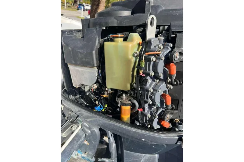 Slide: The Image of 1997 Cobia 244 Center Console boat engine components close-up. - 17