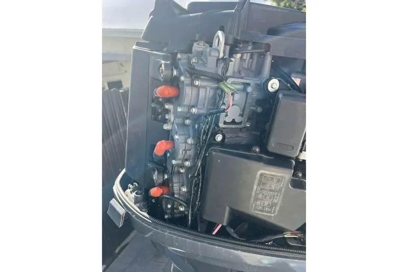 Slide: The Image of Close-up of a 1997 Cobia 244 Center Console boat engine components. - 18