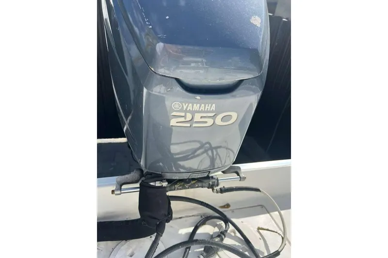 Slide: The Image of Yamaha 250 outboard motor on 1997 Cobia 244 Center Console boat. - 20