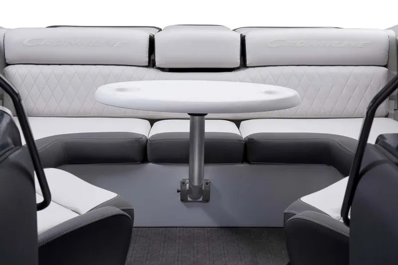 Slide: The Image of Manufacturer Provided Image: 2025 Crownline 220 SS LPX boat interior with white and gray seating and round table. - 11