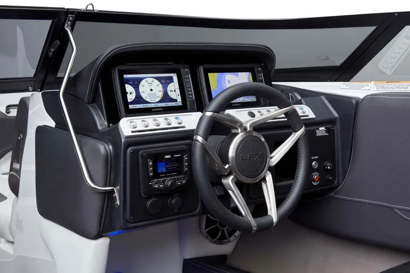 Slide: The Image of Manufacturer Provided Image: 2025 Crownline 220 SS LPX boat dashboard with modern controls and steering wheel. - 12