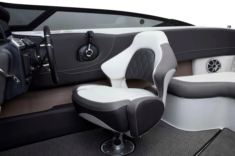 Slide: The Image of Interior of 2025 Crownline 220 SS LPX boat with modern steering and seating. - 13