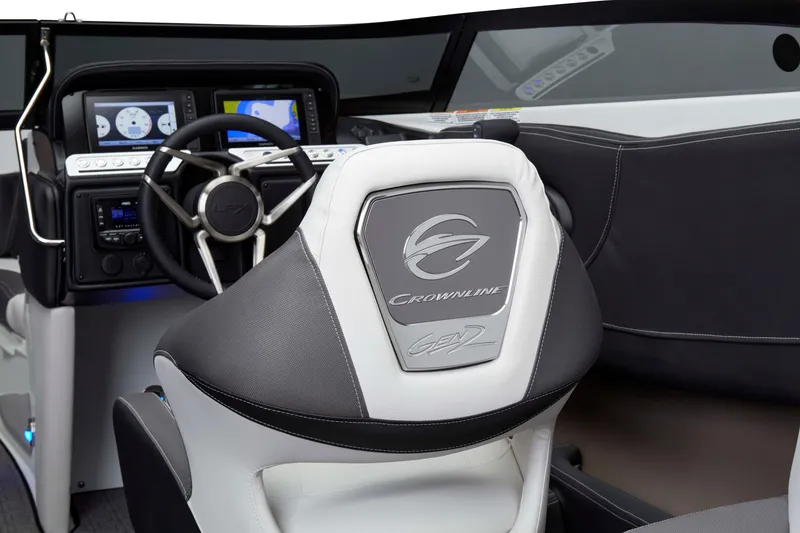Slide: The Image of 2025 Crownline 220 SS LPX boat interior with steering wheel and dashboard controls. - 15