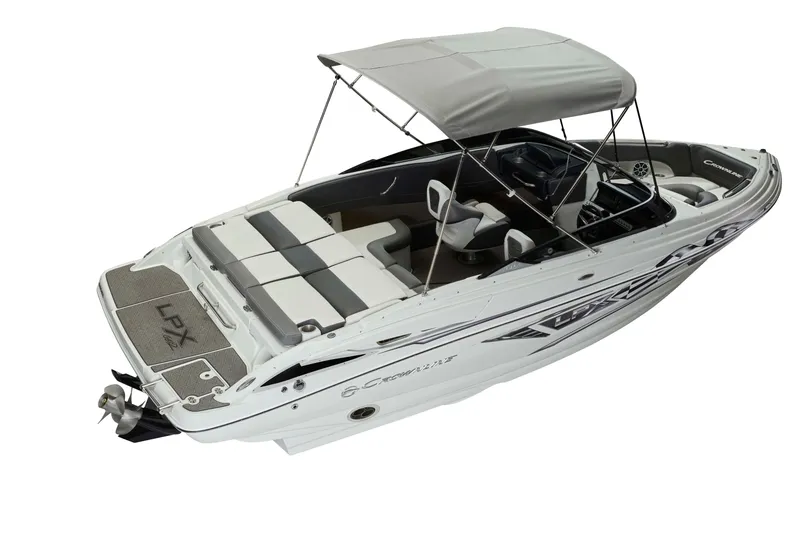 Slide: The Image of 2025 Crownline 220 SS LPX boat with canopy, sleek design, and spacious seating. - 18