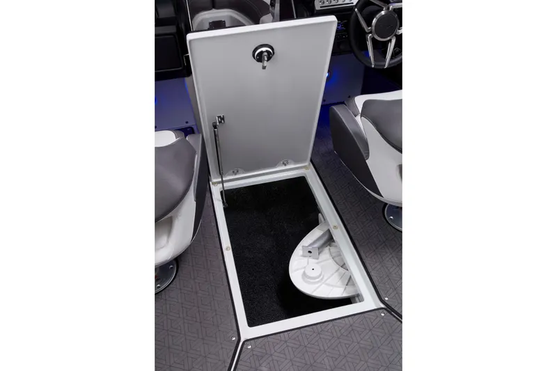 Slide: The Image of 2025 Crownline 220 SS LPX boat interior storage compartment with open hatch. - 20
