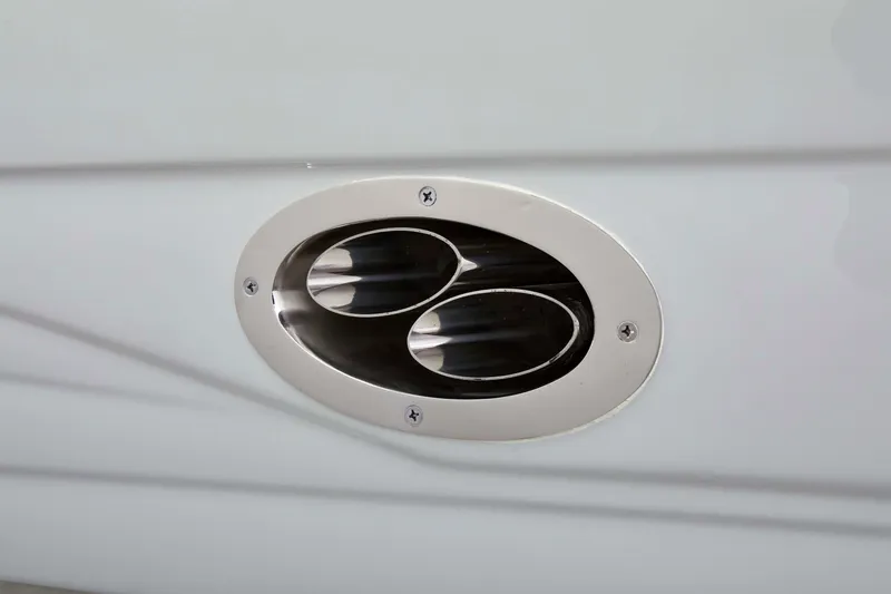 Slide: The Image of 2025 Crownline 220 SS LPX boat exhaust detail, sleek oval design. - 4