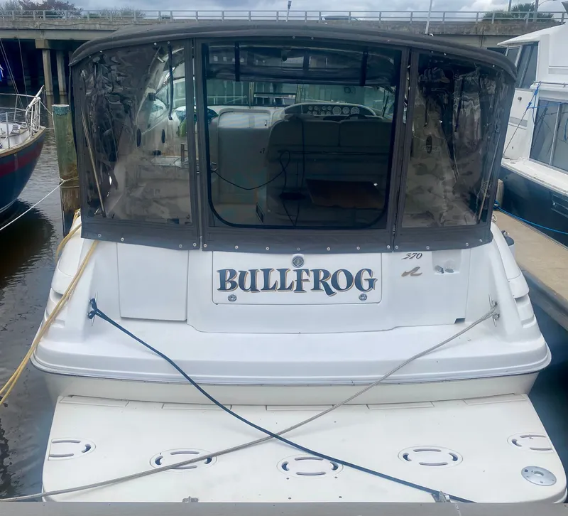 Slide: The Image of Rear view of 1995 Sea Ray Sundancer 370 yacht docked. - 3