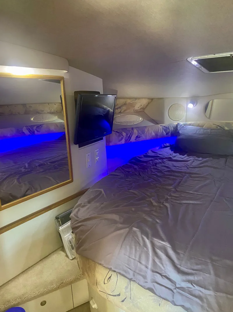 Slide: The Image of Interior of 1995 Sea Ray Sundancer 370 yacht with bed and lighting. - 9