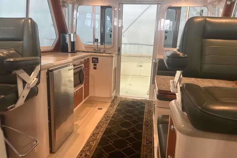Slide: The Image of Interior of 2007 True North 38 Heritage yacht with leather seating and kitchenette. - 12